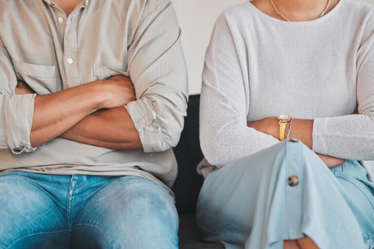 couple crossing arms